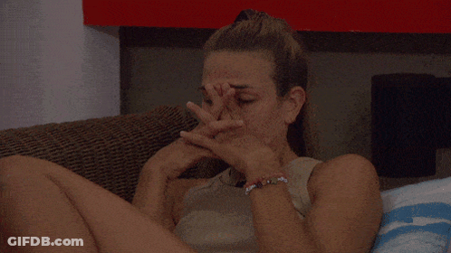 A Woman With A Bracelet On Her Wrist Covering Her Face With Her Hands GIF