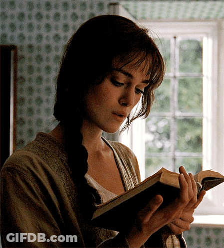 A Woman With A Braid Is Reading A Book GIF