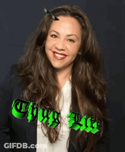 A Woman With A Butterfly In Her Hair And The Words Thug Life GIF