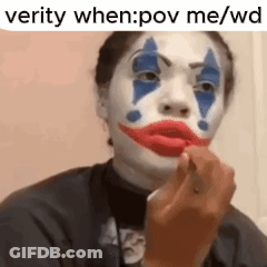 A Woman With A Clown Face Painted On Her Face . GIF