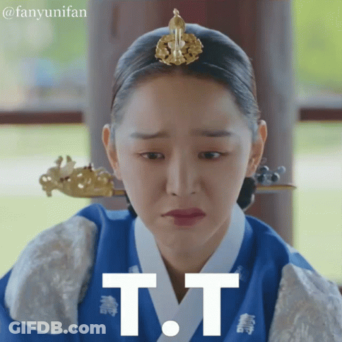 A Woman With A Crown On Her Head Has The Letter T.t. On Her Face GIF