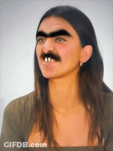 A Woman With A Fake Mustache And Teeth Is Smiling GIF