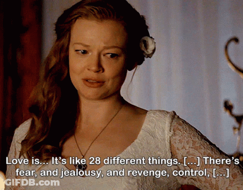 A Woman With A Flower In Her Hair Has A Quote About Love GIF