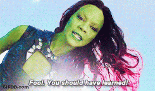 A Woman With A Green Face And Pink Hair Says Fool You Should Have Learned GIF