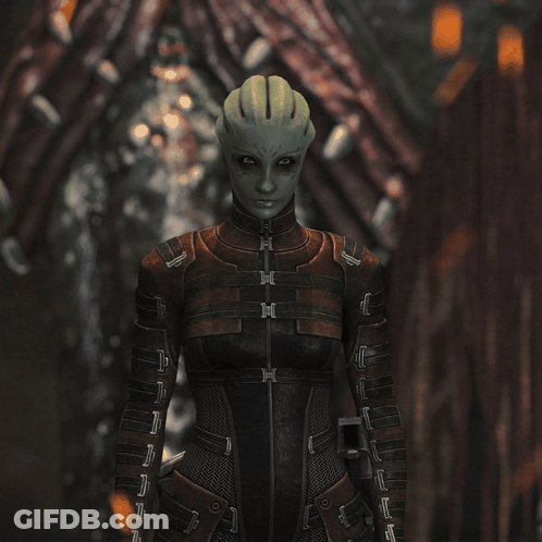 A Woman With A Green Head Is Wearing A Brown And Black Suit GIF