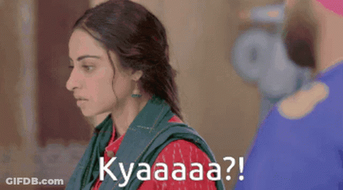 A Woman With A Green Scarf Around Her Neck Says Kyaaaa ? GIF