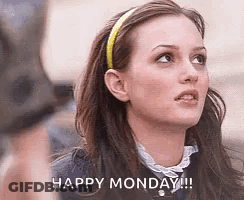 A Woman With A Headband On Her Head Is Looking Up And Saying `` Happy Monday '' . GIF