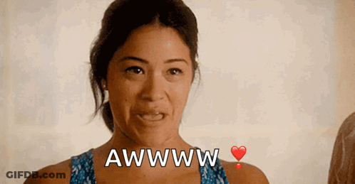 A Woman With A Heart And The Words Awwww On Her Chest GIF