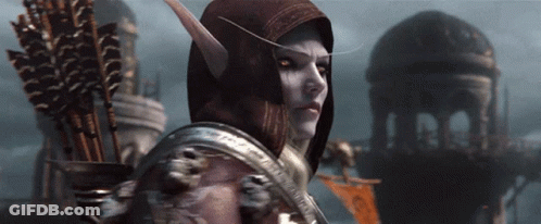 A Woman With A Hood On Her Head Holds A Bow And Arrows GIF