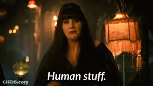 A Woman With A Lamp Behind Her Says " Human Stuff " GIF
