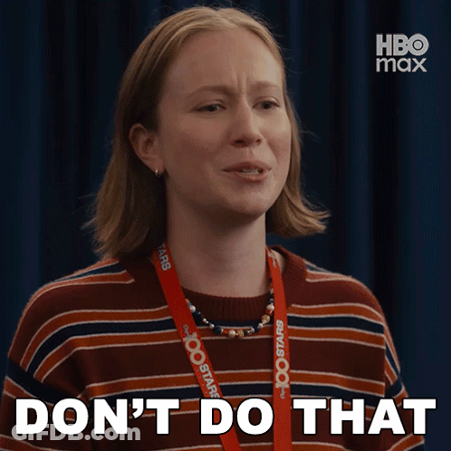 A Woman With A Lanyard Around Her Neck That Says Hbo Max GIF