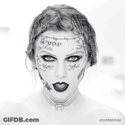 A Woman With A Lot Of Tattoos On Her Face Including One That Says " Tired " GIF
