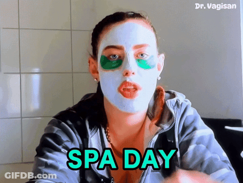 A Woman With A Mask On Her Face And The Words Spa Day GIF
