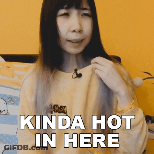 A Woman With A Microphone On Her Neck Says Kinda Hot In Here GIF