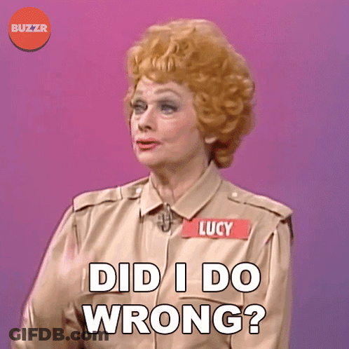 A Woman With A Name Tag That Says Lucy On It GIF