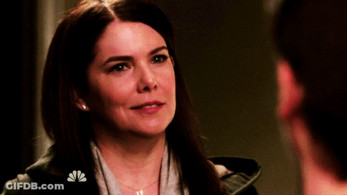 A Woman With A Nbc Logo On Her Chest GIF