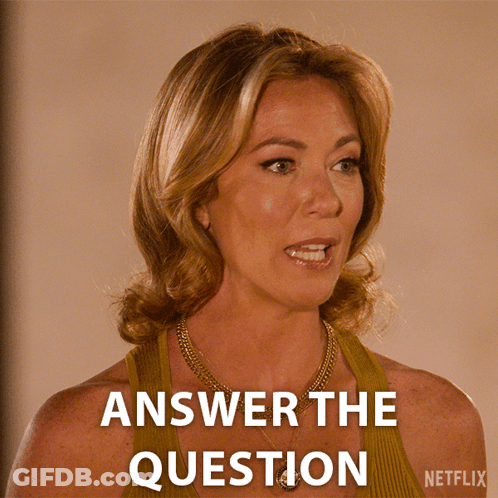 A Woman With A Necklace And A Netflix Logo Behind Her GIF