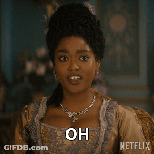 A Woman With A Necklace And Earrings Is Saying My Mistake GIF