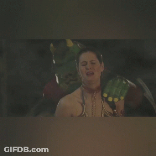 A Woman With A Necklace Around Her Neck Is Being Attacked By A Monster GIF
