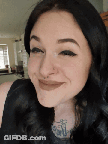 A Woman With A Nose Ring And A Tattoo That Says ' Soft ' GIF