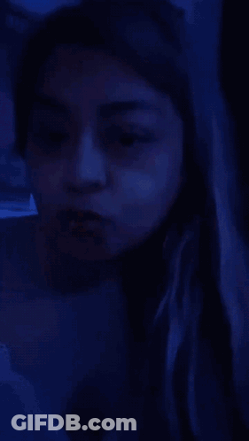 A Woman With A Nose Ring Is Making A Funny Face . GIF