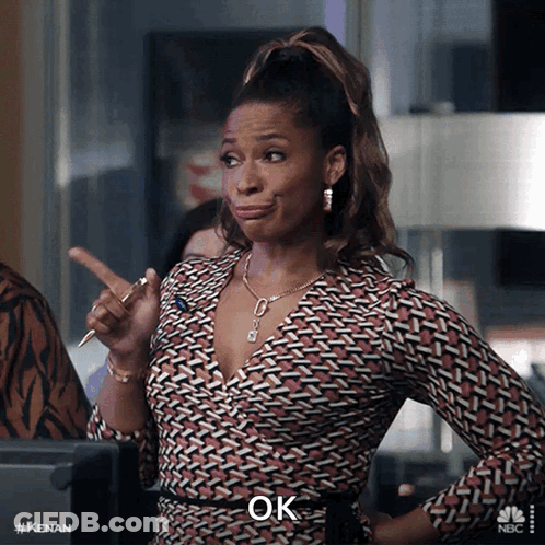 A Woman With A Pen In Her Hand And The Word Ok On The Bottom GIF