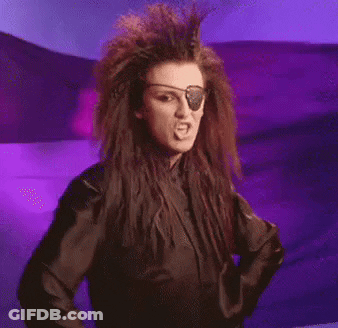 A Woman With A Pirate Eye Patch Is Giving The Middle Finger . GIF