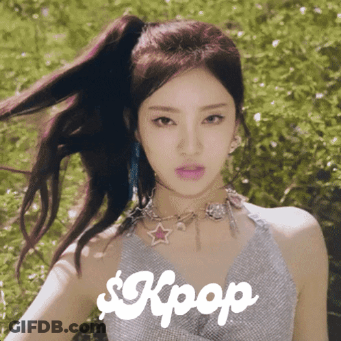 A Woman With A Ponytail And A Necklace With The Word Kpop On It GIF
