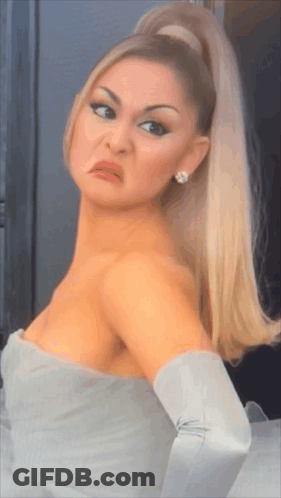 A Woman With A Ponytail Making A Funny Face GIF