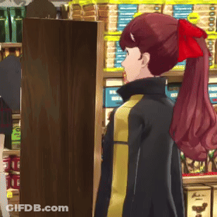 A Woman With A Red Bow In Her Hair Is Standing In Front Of A Shelf That Says Nuts GIF