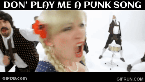 A Woman With A Red Flower In Her Hair Sings A Punk Song GIF
