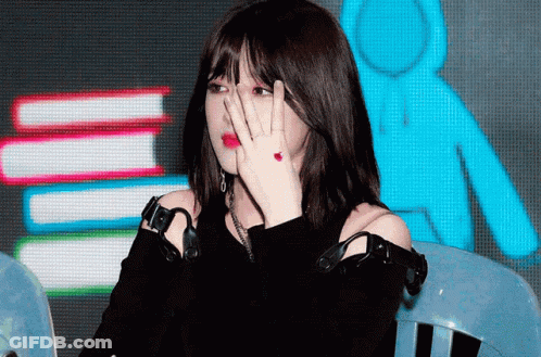 Woman With Red Ring Giving Peace Sign GIF