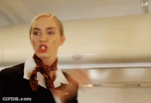 A Woman With A Red Scarf Around Her Neck Has The Letters Lje On The Bottom GIF