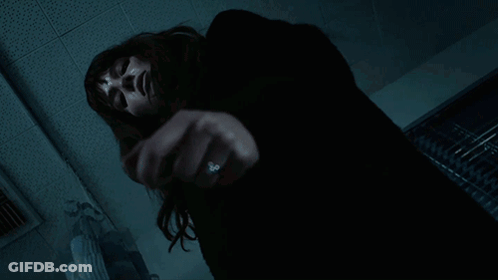 A Woman With A Ring On Her Finger Is Laying On The Floor GIF