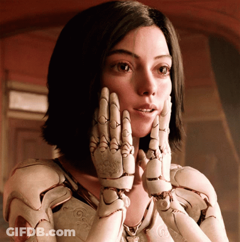A Woman With A Robotic Hand On Her Face GIF