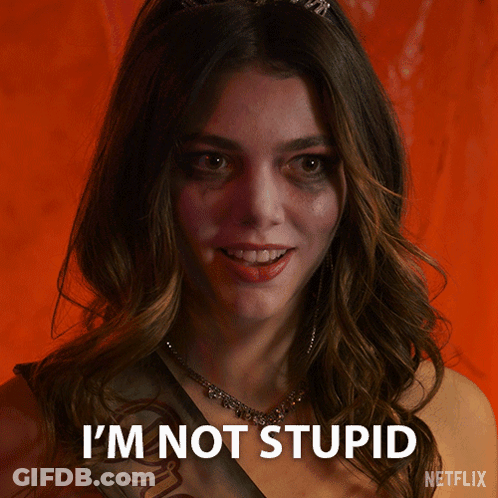 A Woman With A Sash Around Her Neck Says I 'M Not Stupid GIF