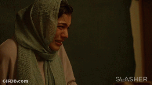 A Woman With A Scarf On Her Head Is Crying With The Words Leave Me Alone Behind Her GIF
