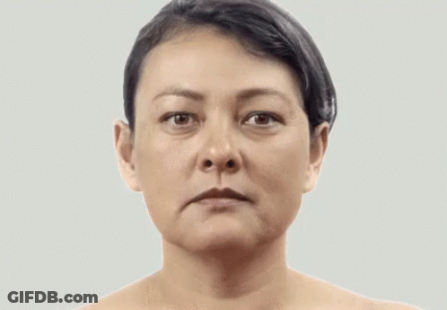 A Woman With A Serious Look On Her Face GIF