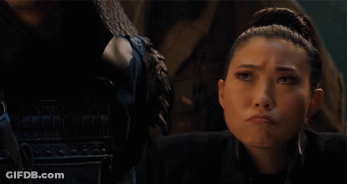 A Woman With A Serious Look On Her Face With The Word Nope Behind Her GIF