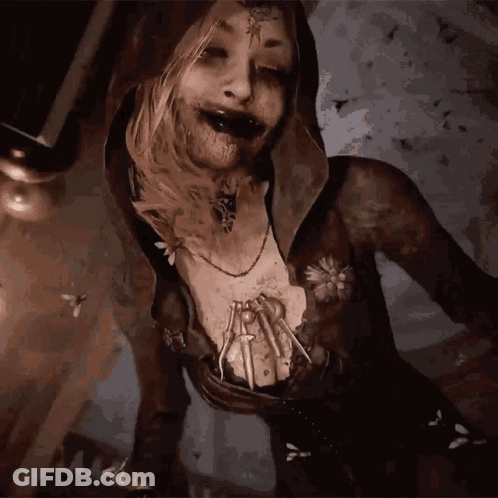 A Woman With A Spider On Her Chest And A Necklace GIF