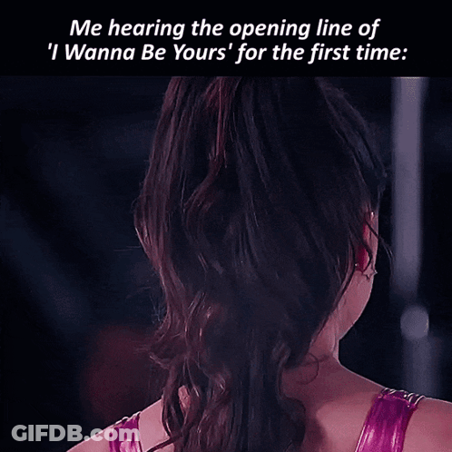 A Woman With A Star Shaped Earring On Her Left Ear Looks At The Camera GIF
