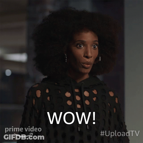 A Woman With A Surprised Look On Her Face And The Word Wow On The Bottom Right GIF