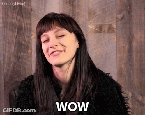 A Woman With A Surprised Look On Her Face And The Word Wow Written Below Her GIF