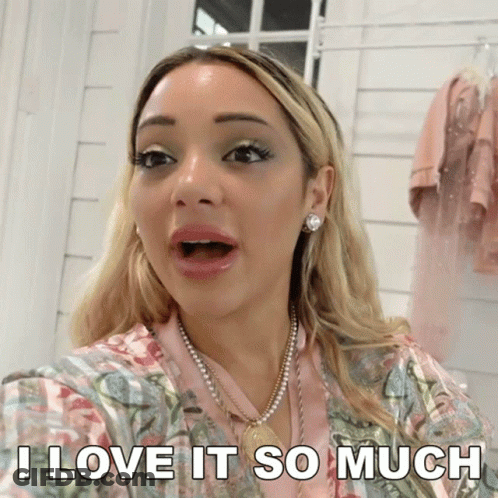 A Woman With A Surprised Look On Her Face And The Words I Love It So Much Below Her GIF