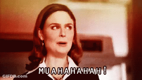 A Woman With A Surprised Look On Her Face And The Words Muahahah Written Above Her GIF