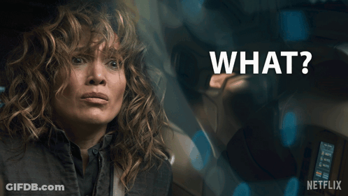 Surprised Woman With Words What Above Her GIF