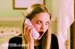 A Woman With A Surprised Look On Her Face Is Talking On A Cell Phone GIF