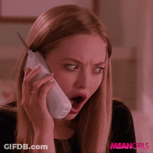 A Woman With A Surprised Look On Her Face Is Talking On A Phone With Meangirls Written On The Bottom Right GIF