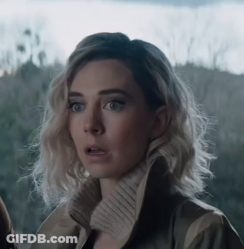 A Woman With A Surprised Look On Her Face Is Wearing A Jacket . GIF