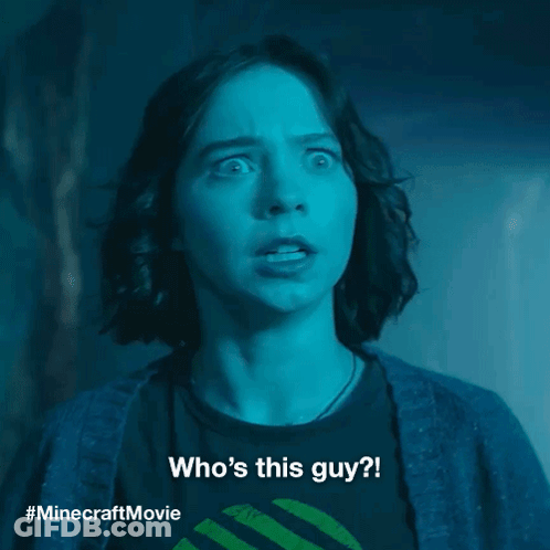 A Woman With A Surprised Look On Her Face Is Wearing A Minecraft Movie Shirt GIF